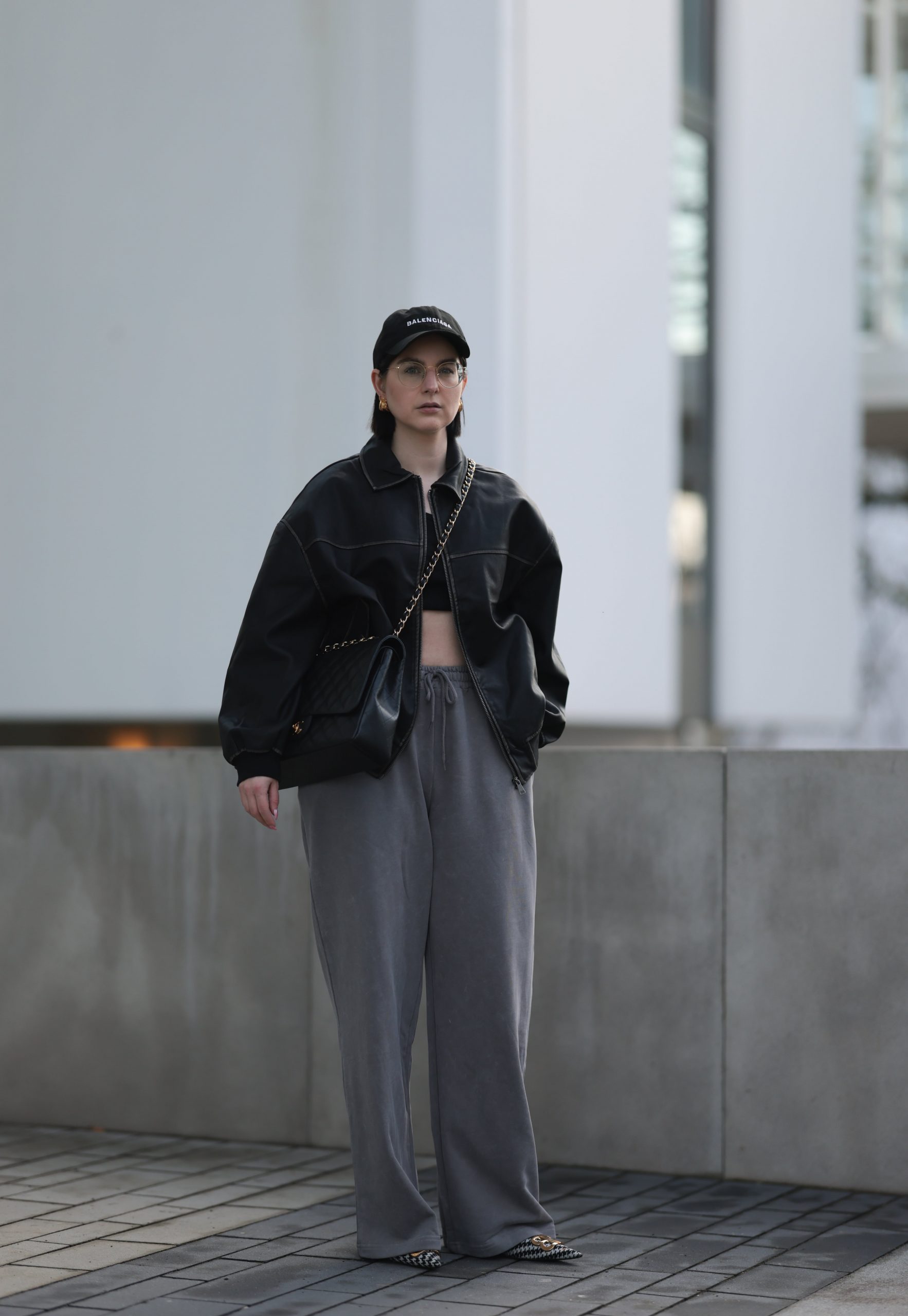 Edgy Urban Vibe: Leather Jacket and Bralette with Grey Sweatpants — Sweatpants Outfits