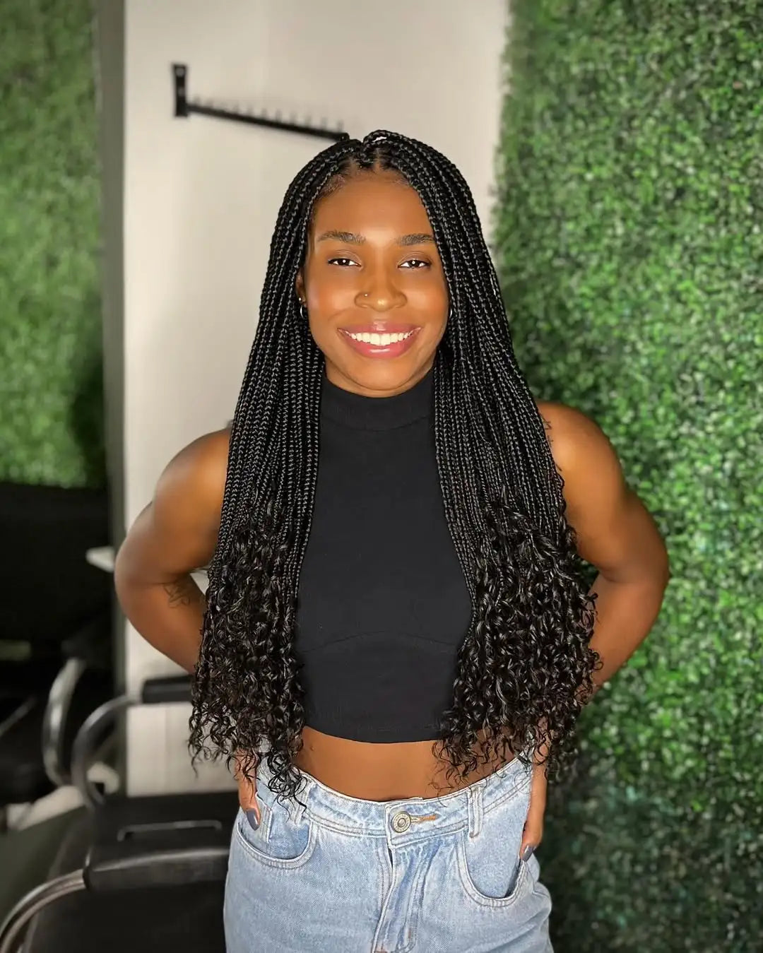 Box Braids With Added Curly Extensions Vibrant Red Braids in a High Bun — Winter Braid Colors for Black Women