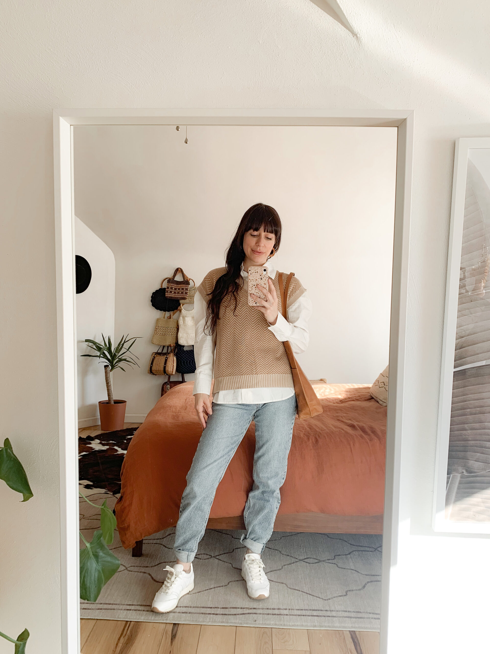 Layered Sweater Vest with White Shirt and Jeans — Early Winter Outfits