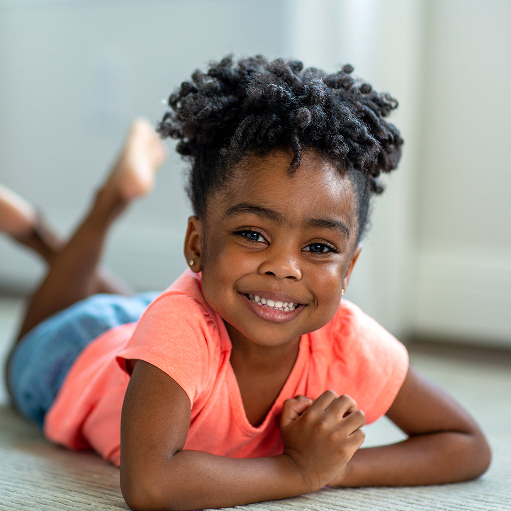 Voluminous Shoulder-Length Curls — Winter Hairstyles for Black Kids