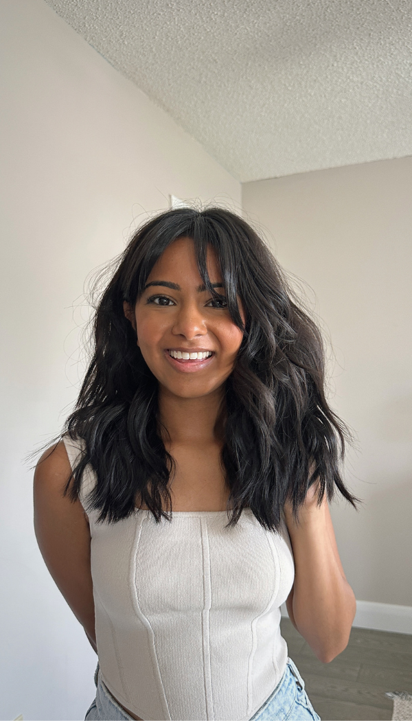 Layered Dark Wavy Hair with Face-Framing Pieces Layered Dark Wavy Hair with Face-Framing Pieces — Trendy Haircuts for Women