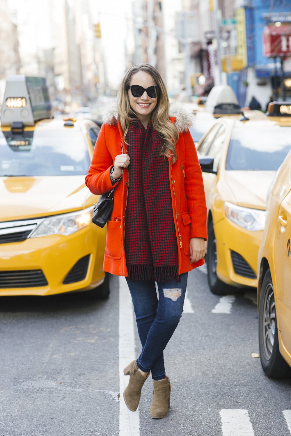 Bold Parka Statement: Orange Jacket with Ripped Jeans — Comfy Winter Outfits