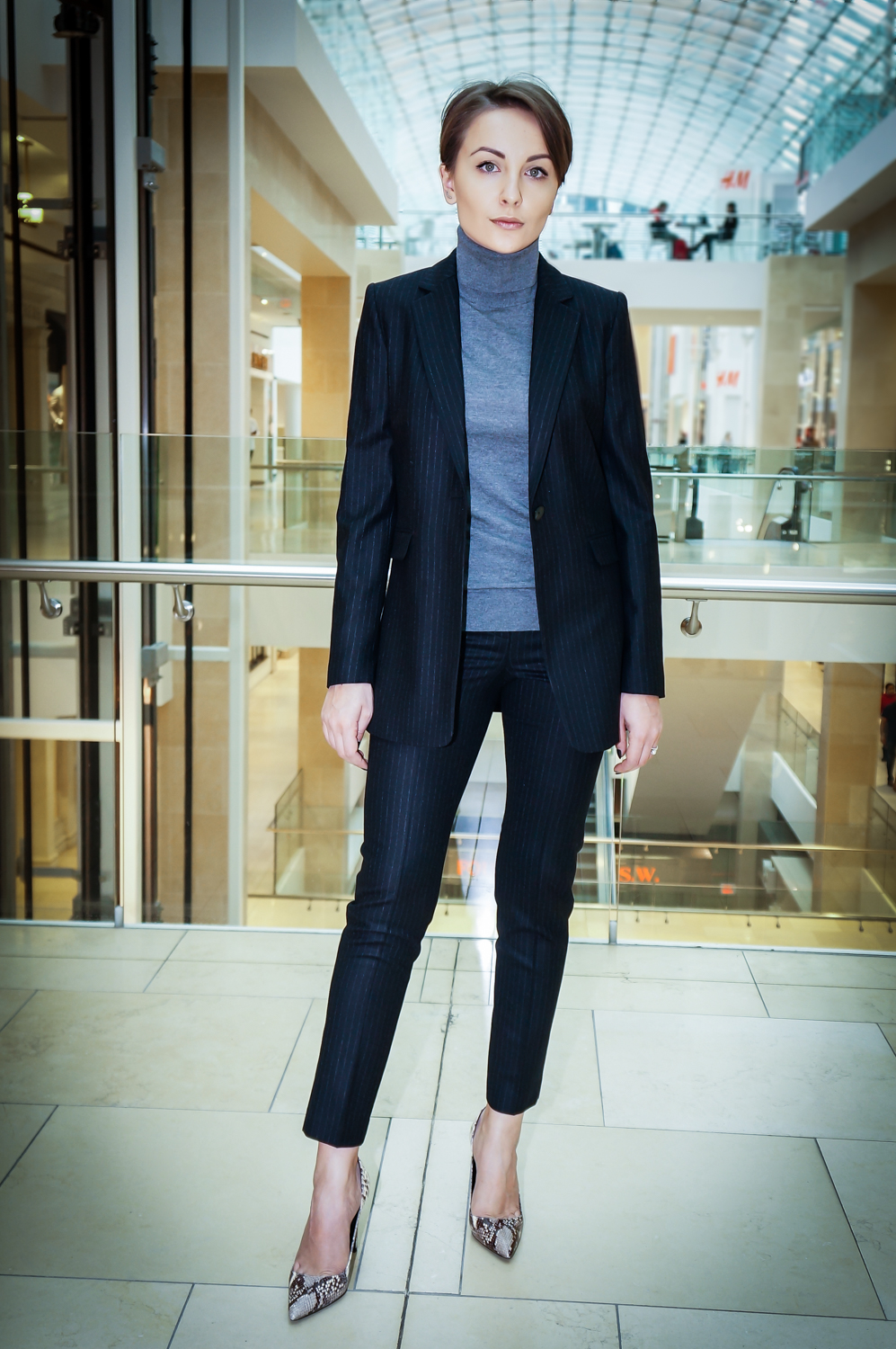 Sharp Pinstripe Suit with a Grey Turtleneck Base Sharp Pinstripe Suit with a Grey Turtleneck Base — Winter Work Outfits