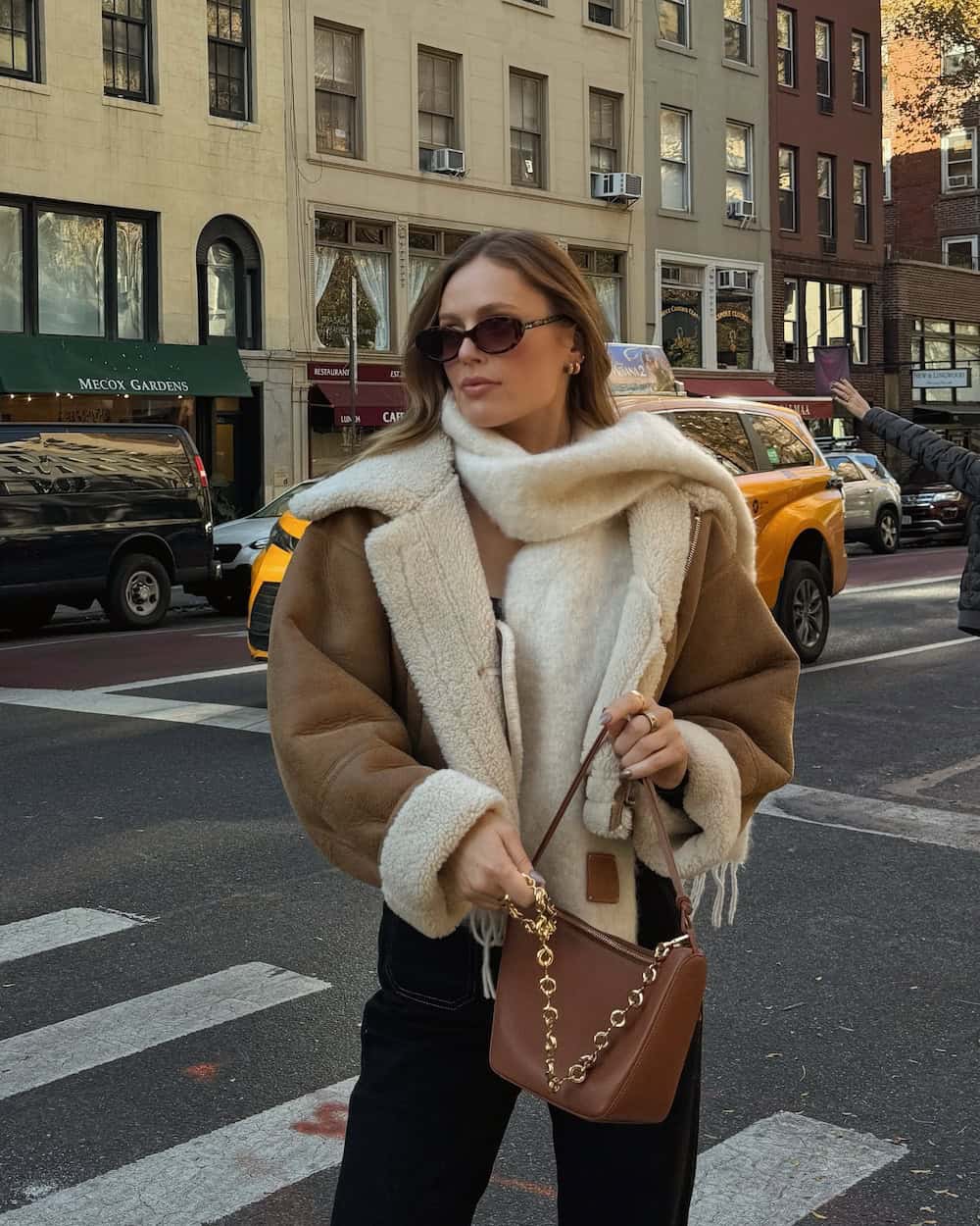 Shearling-Lined Jacket with Black Trousers and a Draped Cream Scarf Shearling-Lined Jacket with Black Trousers and a Draped Cream Scarf — NYC Winter Outfits