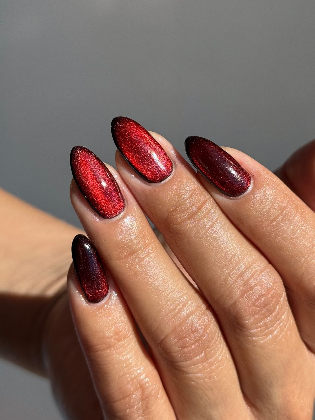 Deep Red Magnetic Cat-Eye Oval Nails Deep Red Magnetic Cat-Eye Oval Nails — Winter Nail Colors for Women Over 50