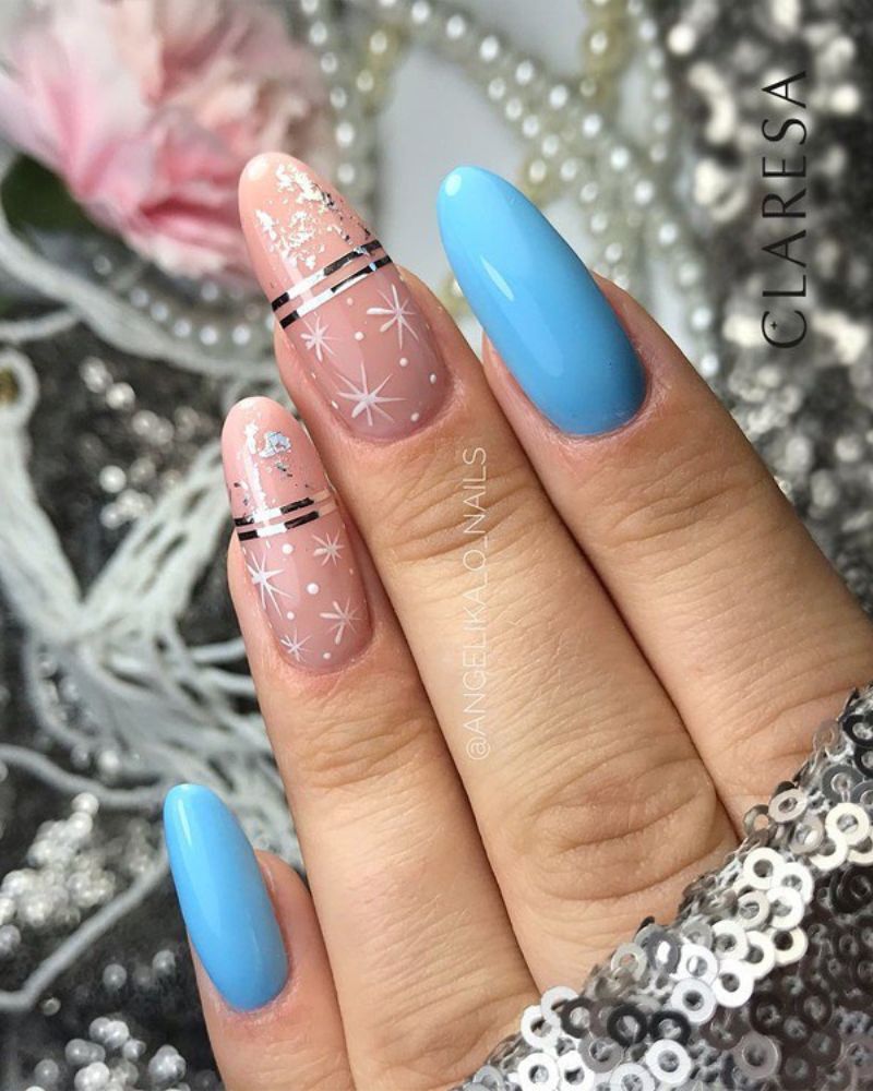 Blue Snowflake Accent Oval Almond Nails Blue Snowflake Accent Oval Almond Nails — Medium Length Winter Nails