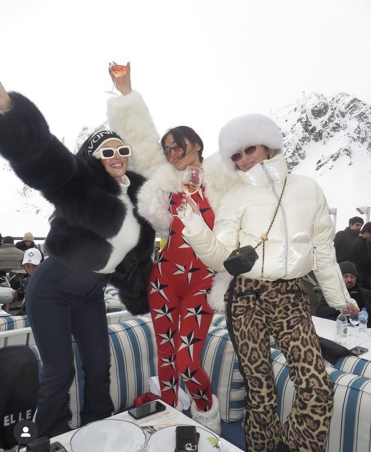 Monochromatic Ski Suits and Fur Accents Monochromatic Ski Suits and Fur Accents — Apres Ski Outfits