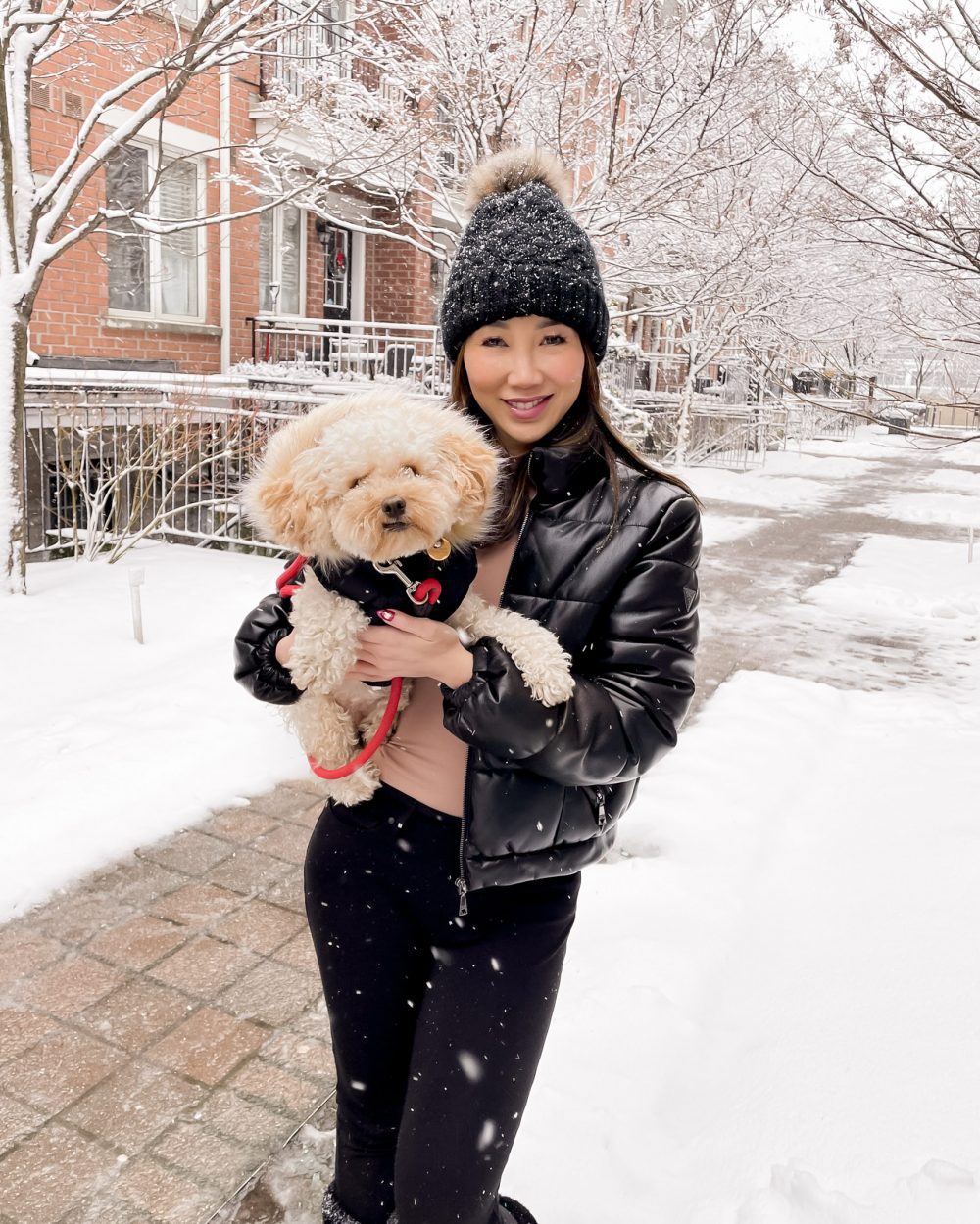 Black Puffer Jacket and Pink Top for a Bold Snow Day Look — Snow Day Outfits