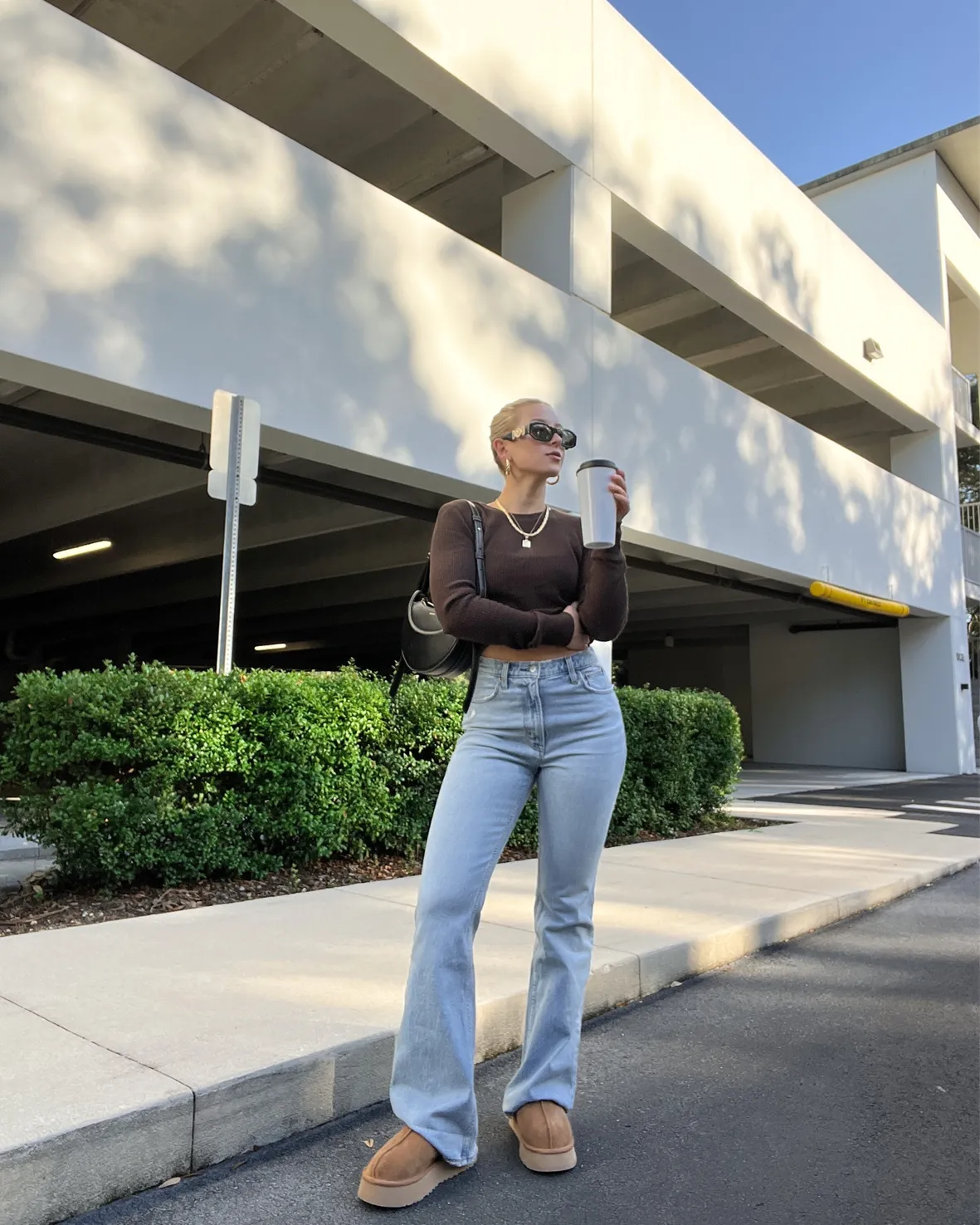 Flared Jeans and Cropped Top with Platform Uggs — Ugg Slippers Outfits