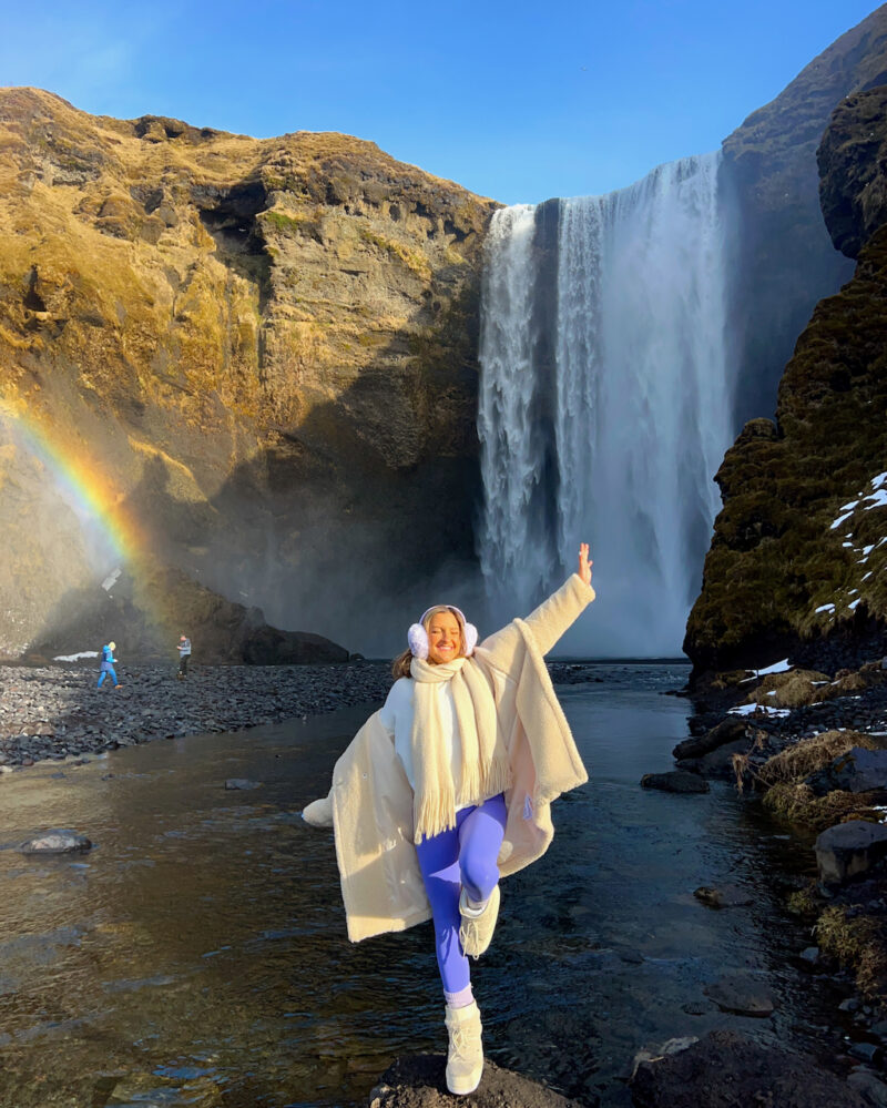 Cream Knit Poncho Over a White Sweater with Purple Leggings Cream Knit Poncho Over a White Sweater with Purple Leggings — Iceland Winter Outfits