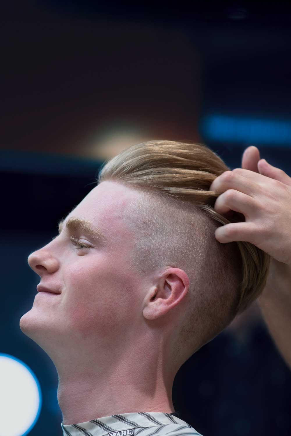 Slicked-Back Undercut With Volume Slicked-Back Undercut With Volume — Winter Haircuts for Boys