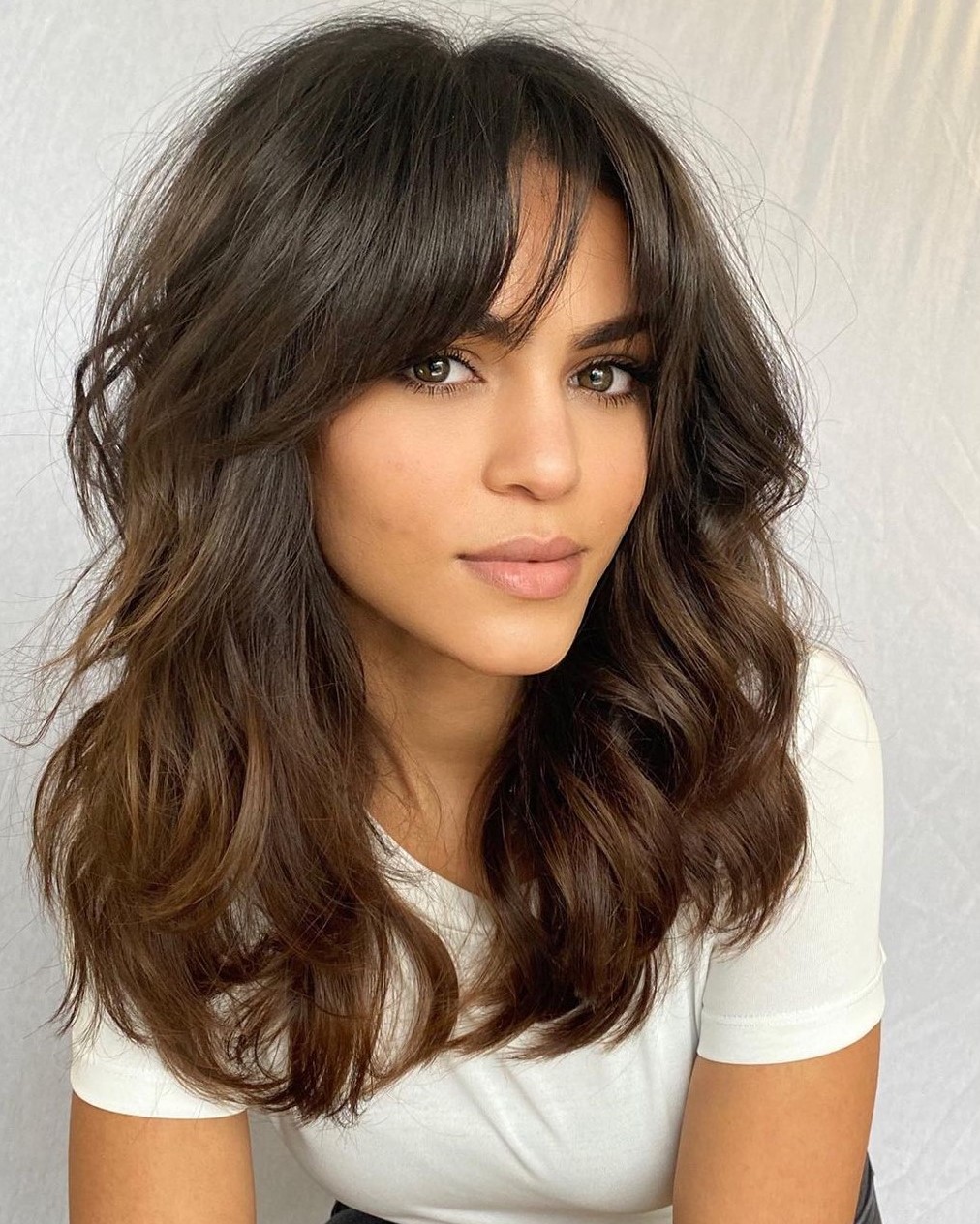 Effortless Layered Brown Hair with White T-Shirt Effortless Layered Brown Hair with White T-Shirt — Trendy Haircuts for Women