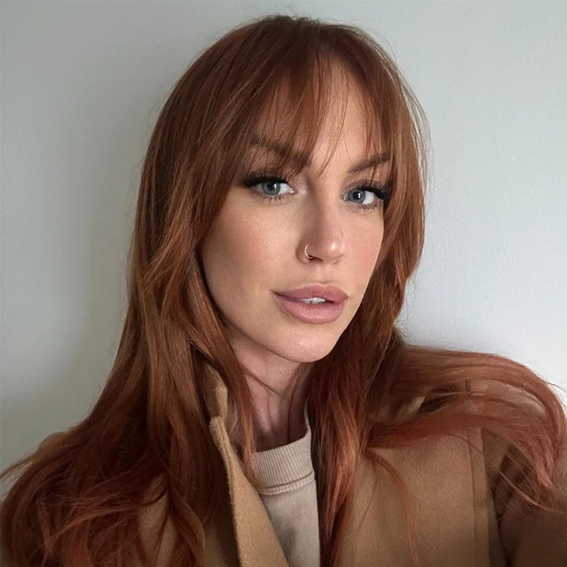 Warm Copper Collarbone Layers With Full Wispy Bangs Warm Copper Collarbone Layers With Full Wispy Bangs — Winter Haircuts with Bangs
