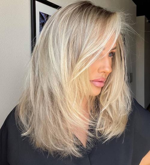 Voluminous Blowout With Platinum Blonde Voluminous Blowout With Platinum Blonde — Winter Shoulder Length Hairstyles