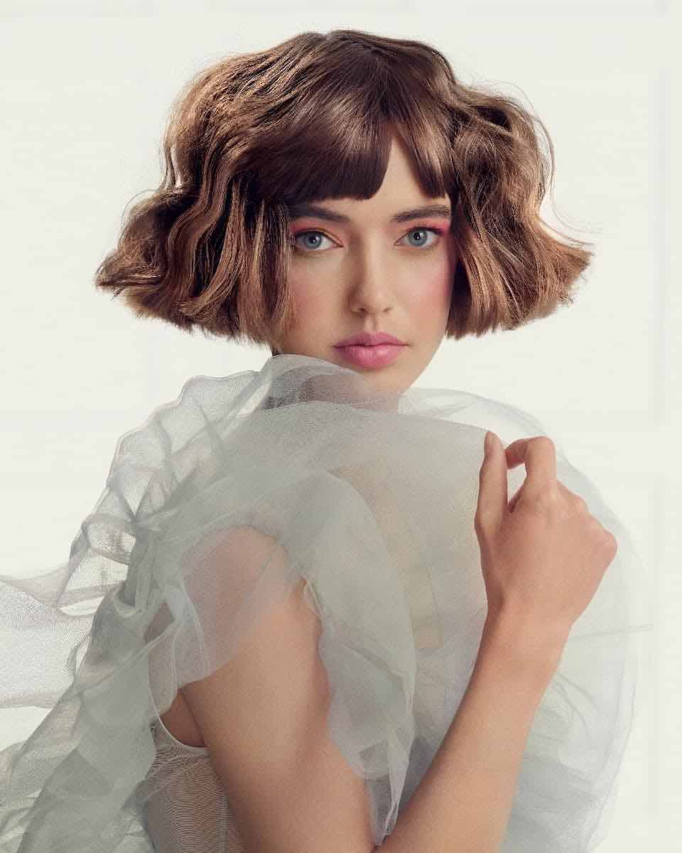 Chin-Length Bob With Blunt Bangs Chin-Length Bob With Blunt Bangs — Winter Haircuts for Wavy Hair