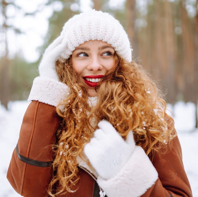 Reddish-Brown Layers With Curtain Bangs Reddish-Brown Layers With Curtain Bangs — Winter Haircuts for Curly Hair
