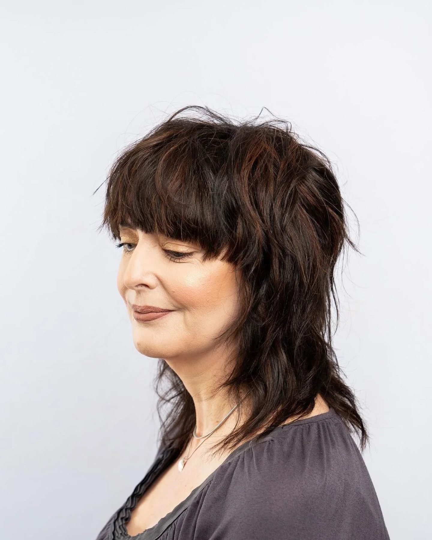 Dark Brown Shag with Blunt Bangs — Winter Hairstyles for Women Over 50