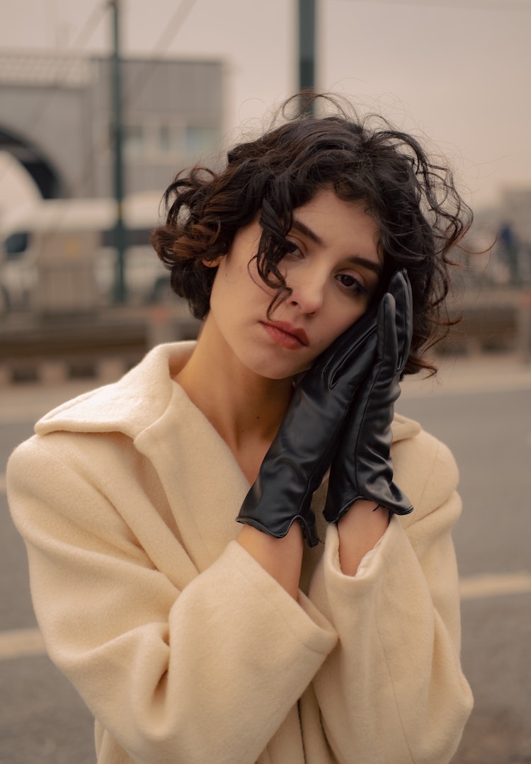 Short Bob With Textured Side Bangs Short Bob With Textured Side Bangs — Winter Haircuts for Curly Hair