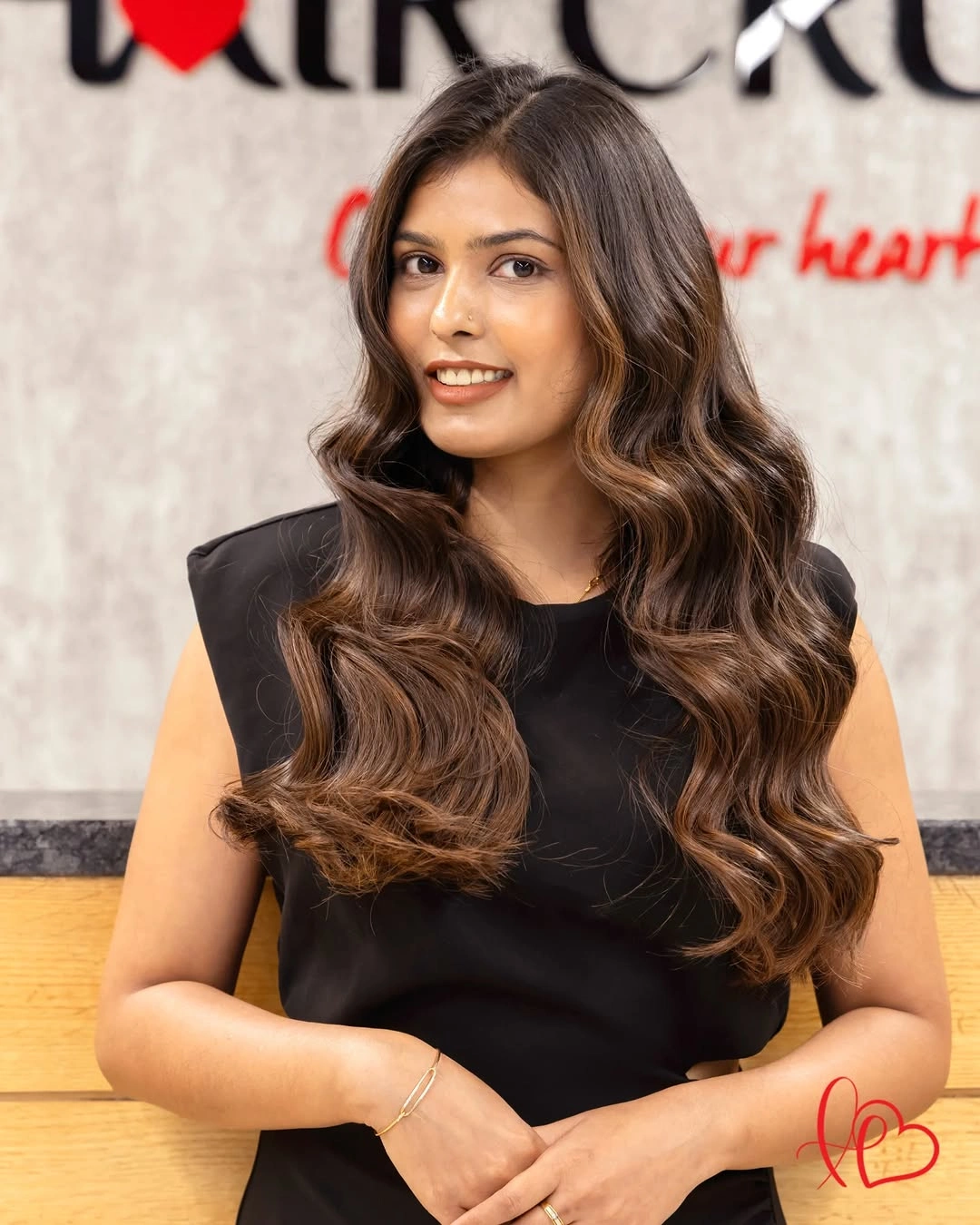 Long brunette hair with large waves and lighter front pieces