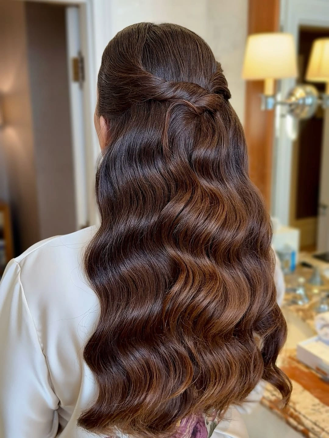 Long brunette half-up hair with smooth repeating waves