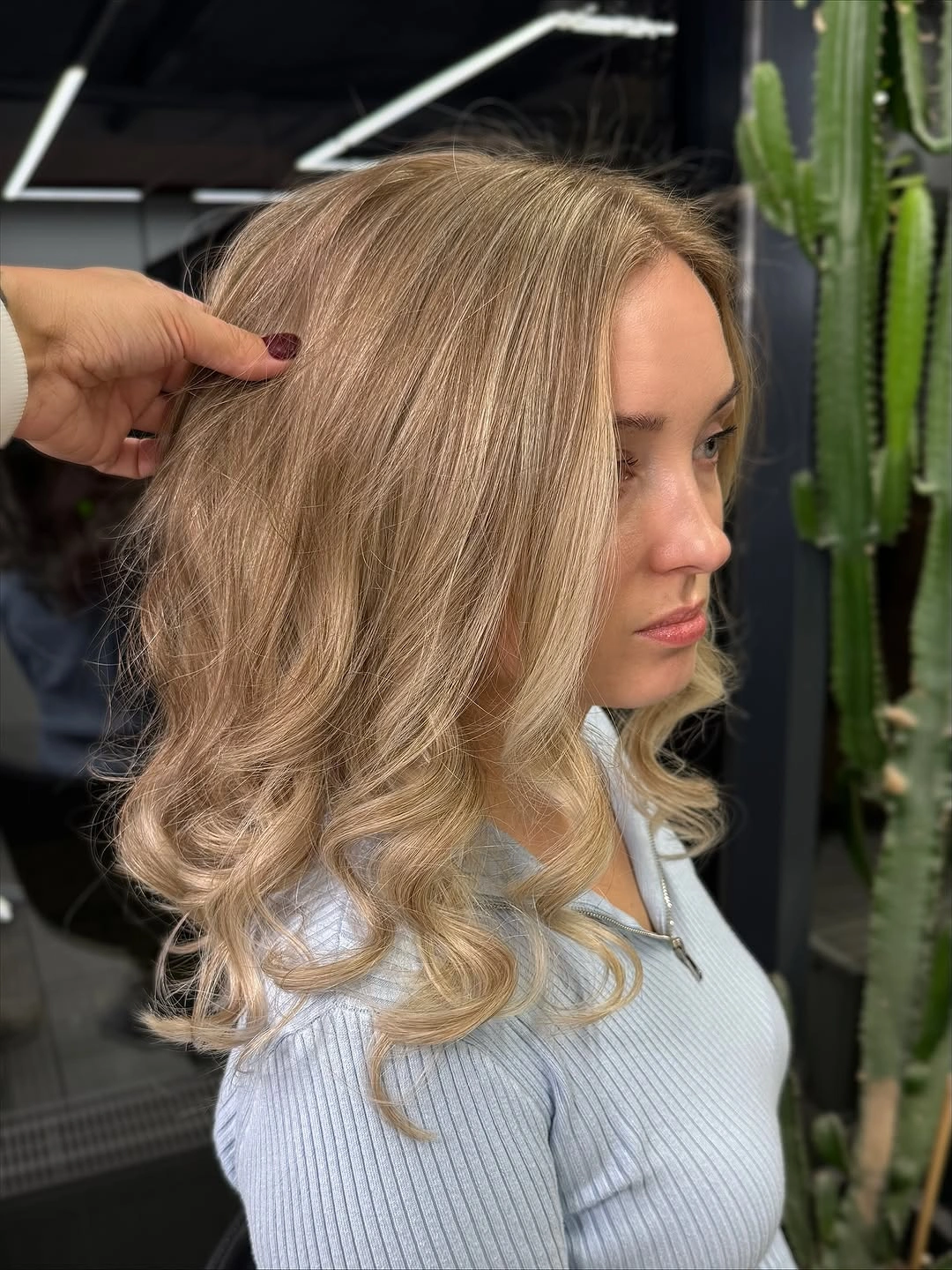 Blonde medium hair with loose waves and face-framing pieces