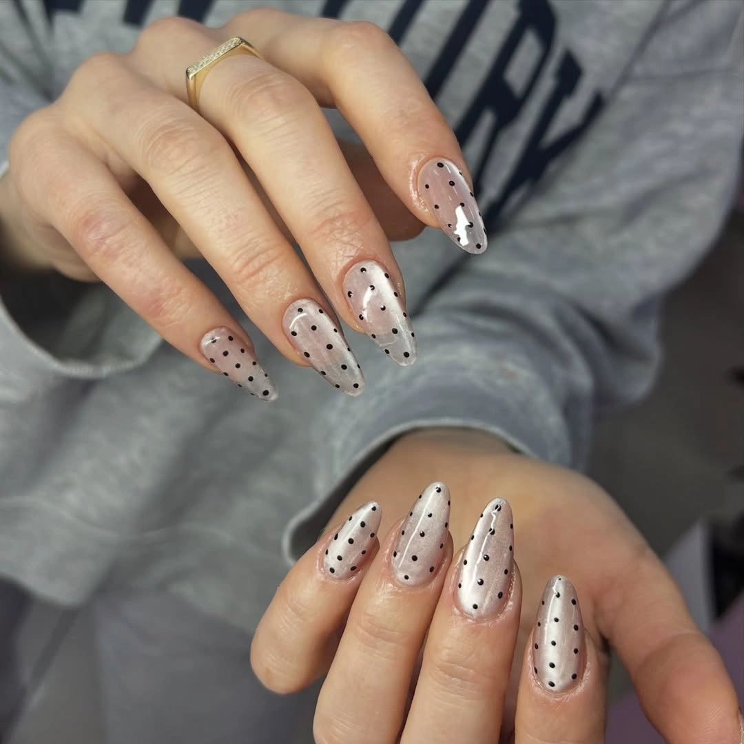 Pale blue and white nails with snowflakes and snowman detail
