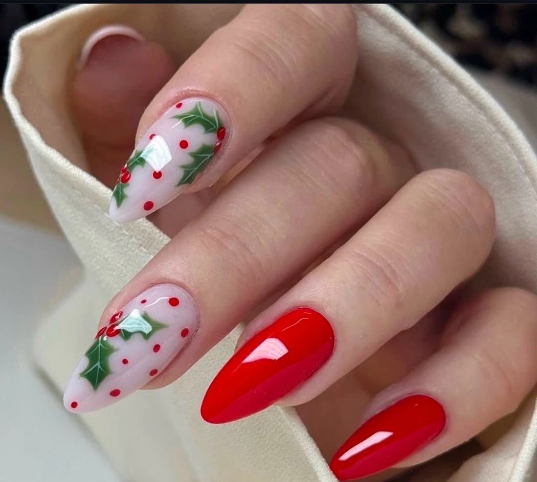 Sheer pink almond nails with bright pink edges and white snowflakes