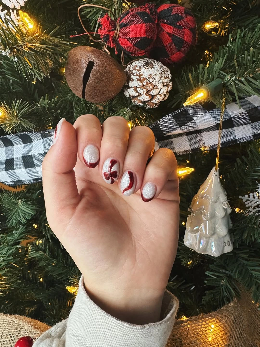 Very long square nails with pink, blue, white, and raised accents