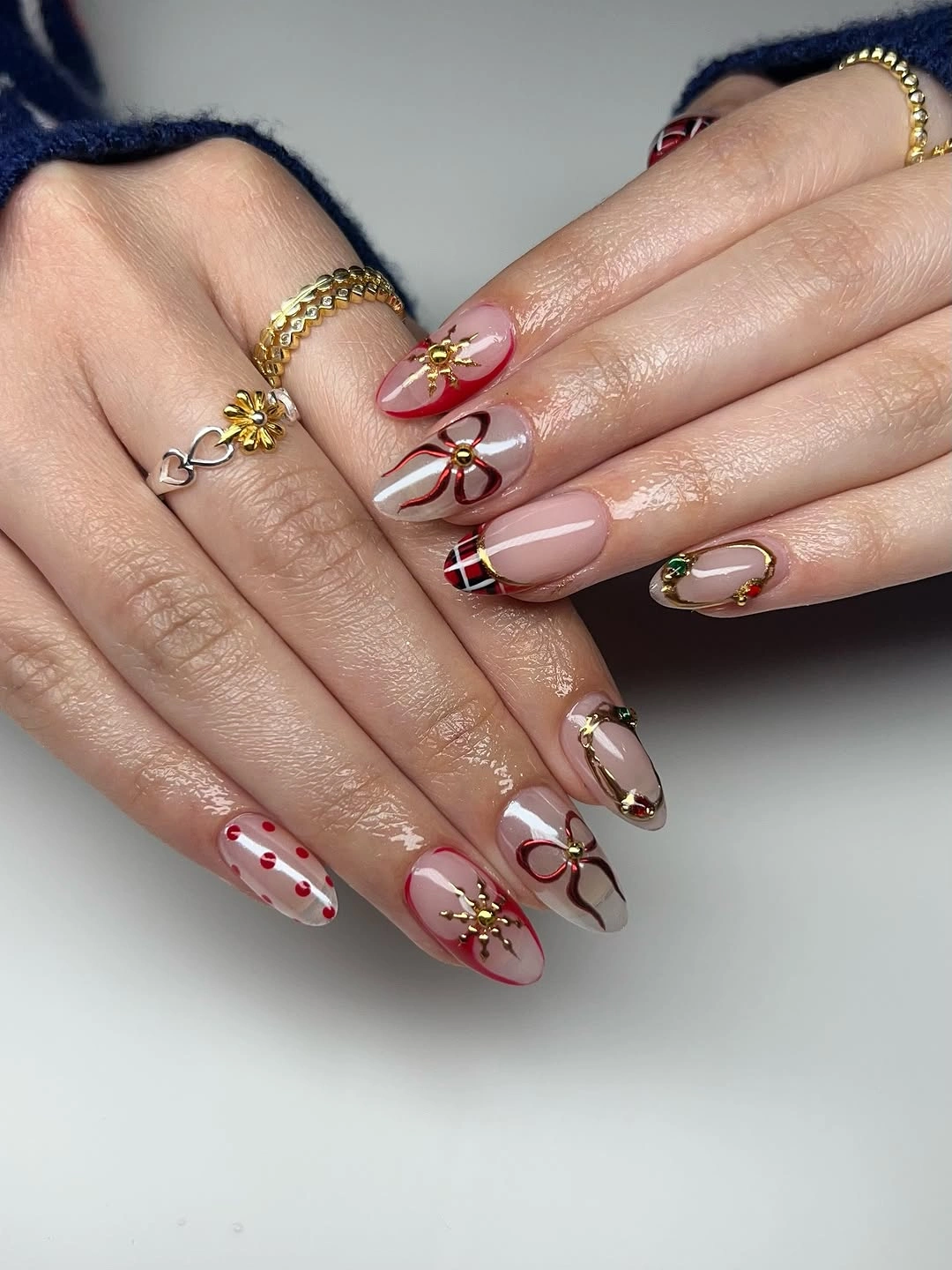 Nude pink square nails with white lines, stars, and dots