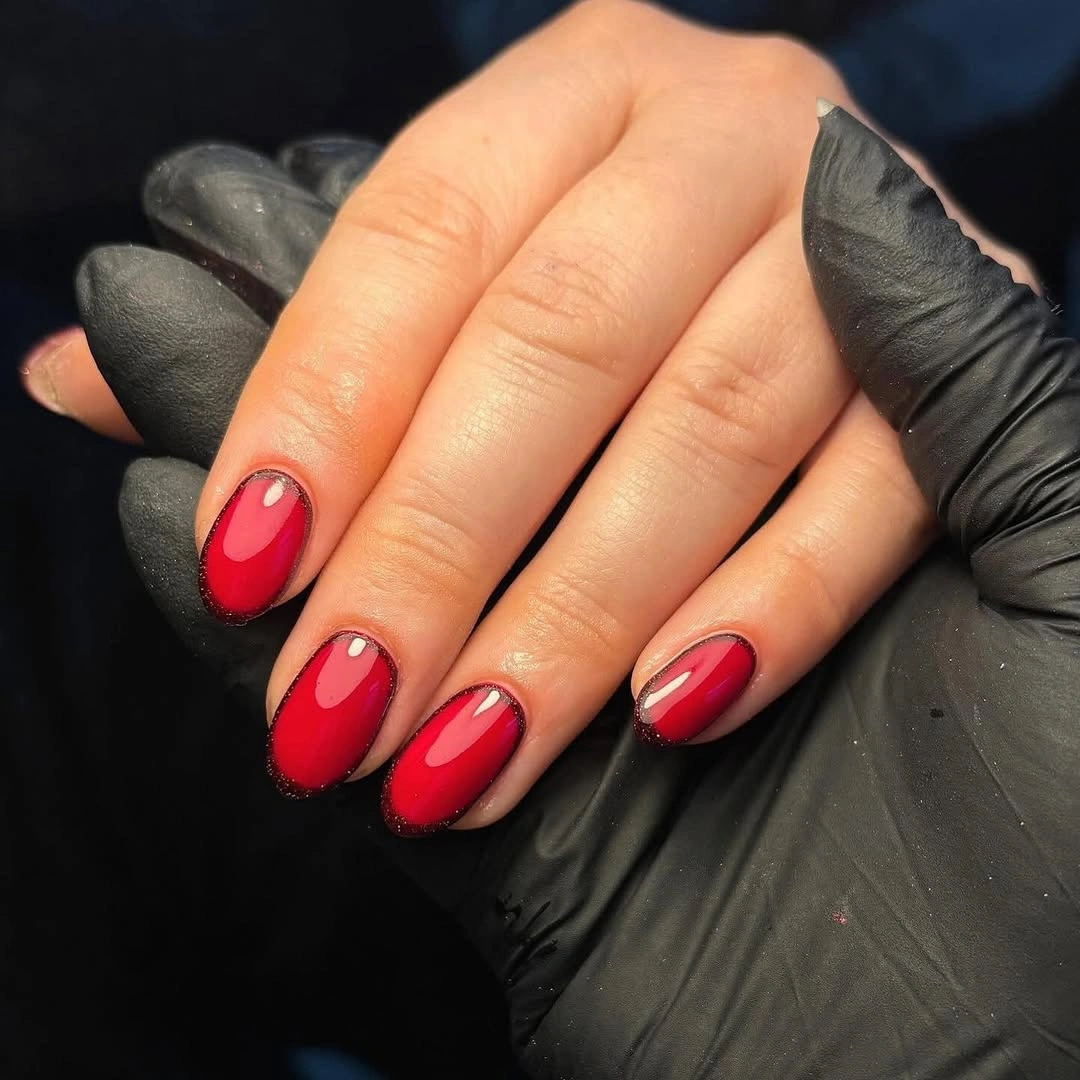 Pale almond nails with gems and a small Christmas tree