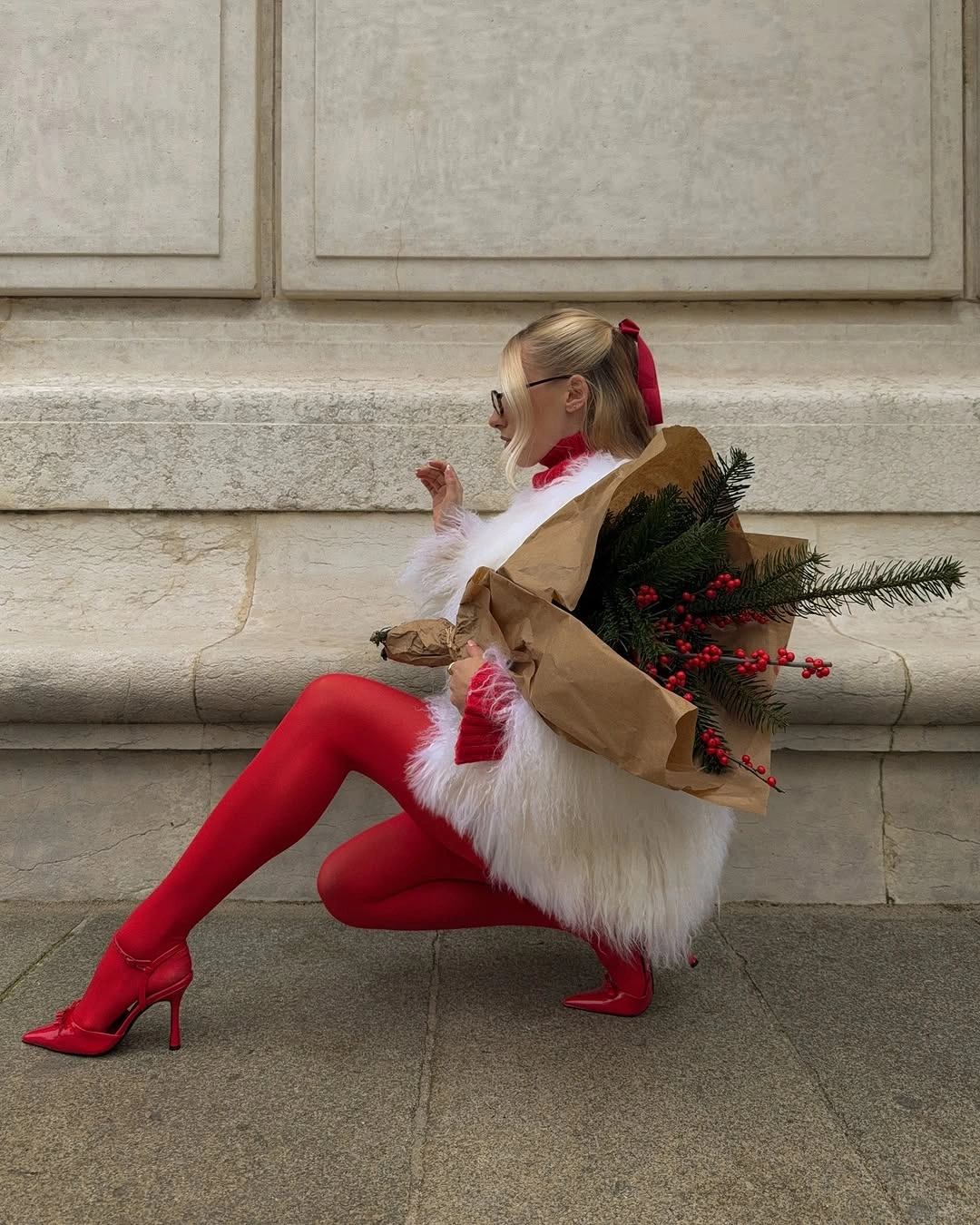 White fuzzy mini outfit with red tights and red heels