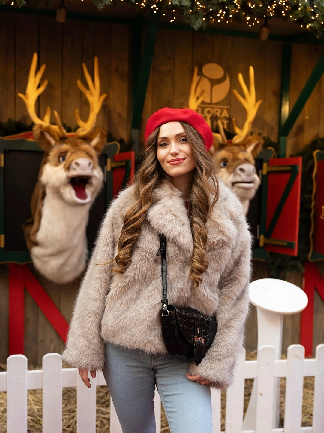 Red beret, pale fuzzy jacket, jeans, and black crossbody bag