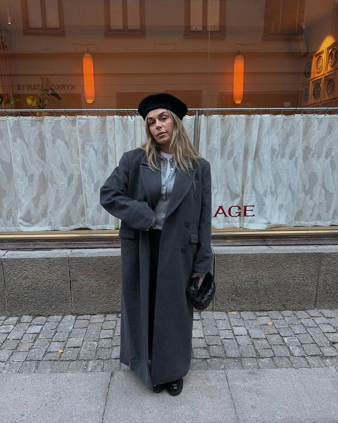 Charcoal long coat with beret, sunglasses, and small black bag
