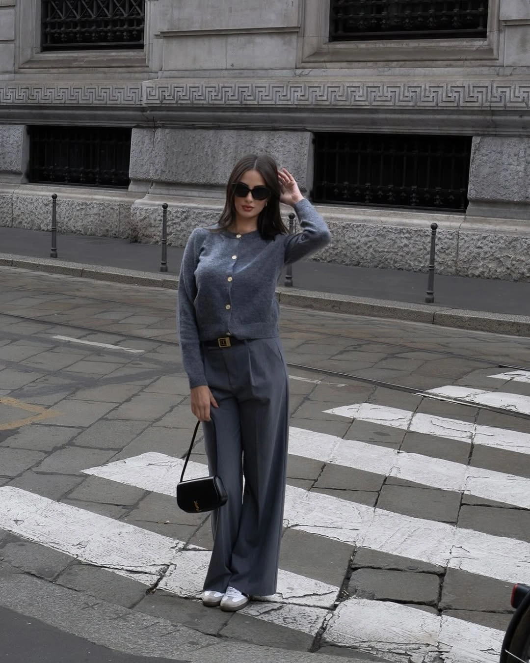 Slate-gray matching knit set with belt, black bag, and sneakers