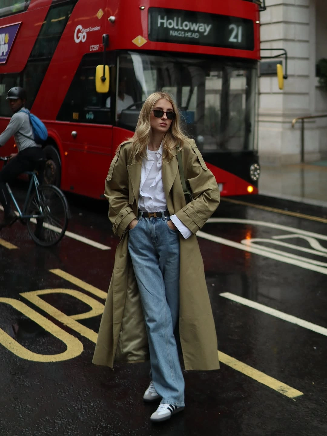 Olive long coat, white shirt, wide jeans, and sneakers