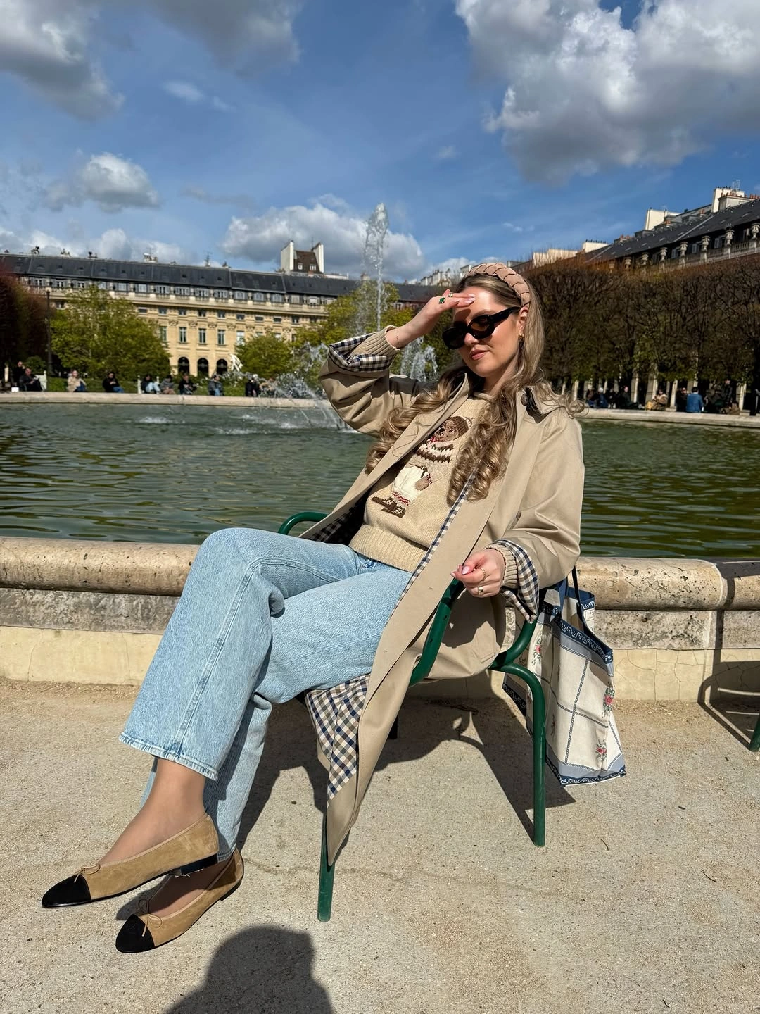 Beige coat, checked knit, light jeans, black flats