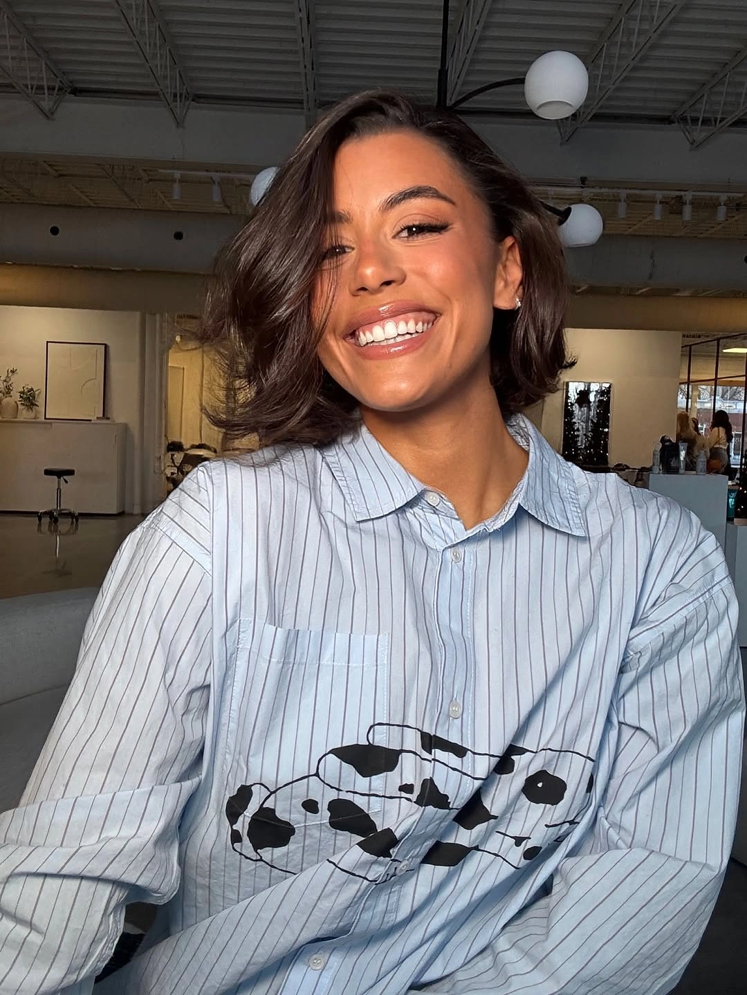 Short brunette wavy hair with a deep side sweep