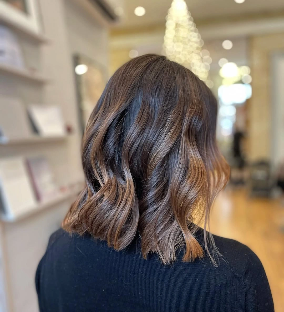 Dark shoulder-length wavy hair viewed from the back and side