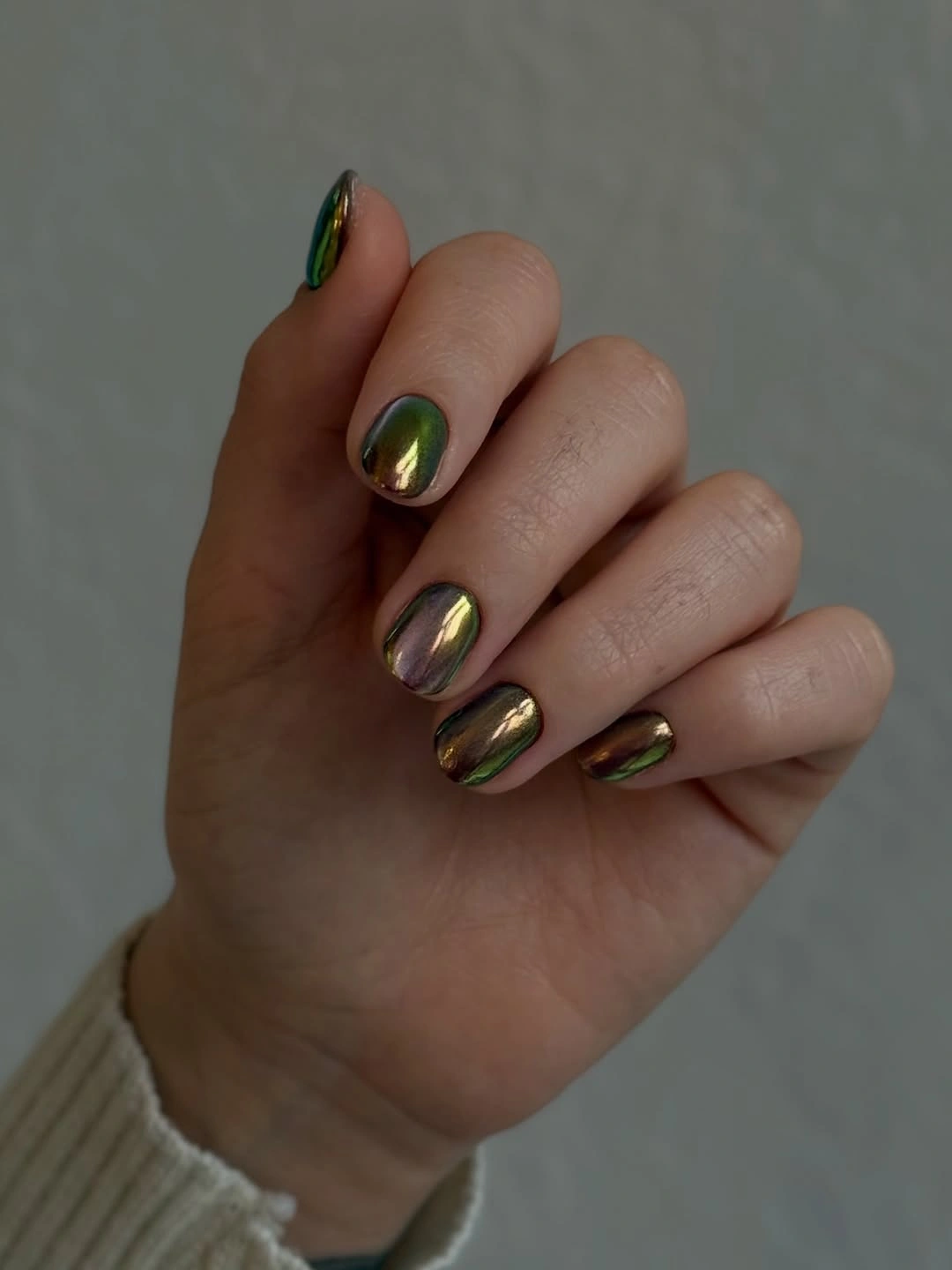 Tapered nails with black waves, star motif, reflective shard, and gold details