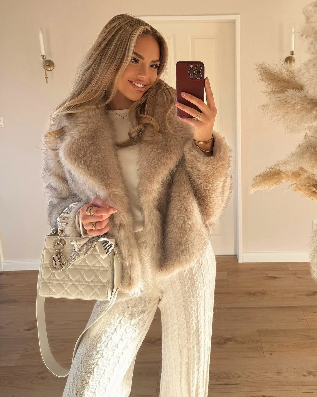 Pale plush-textured jacket with cable-knit-looking pants and quilted handbag