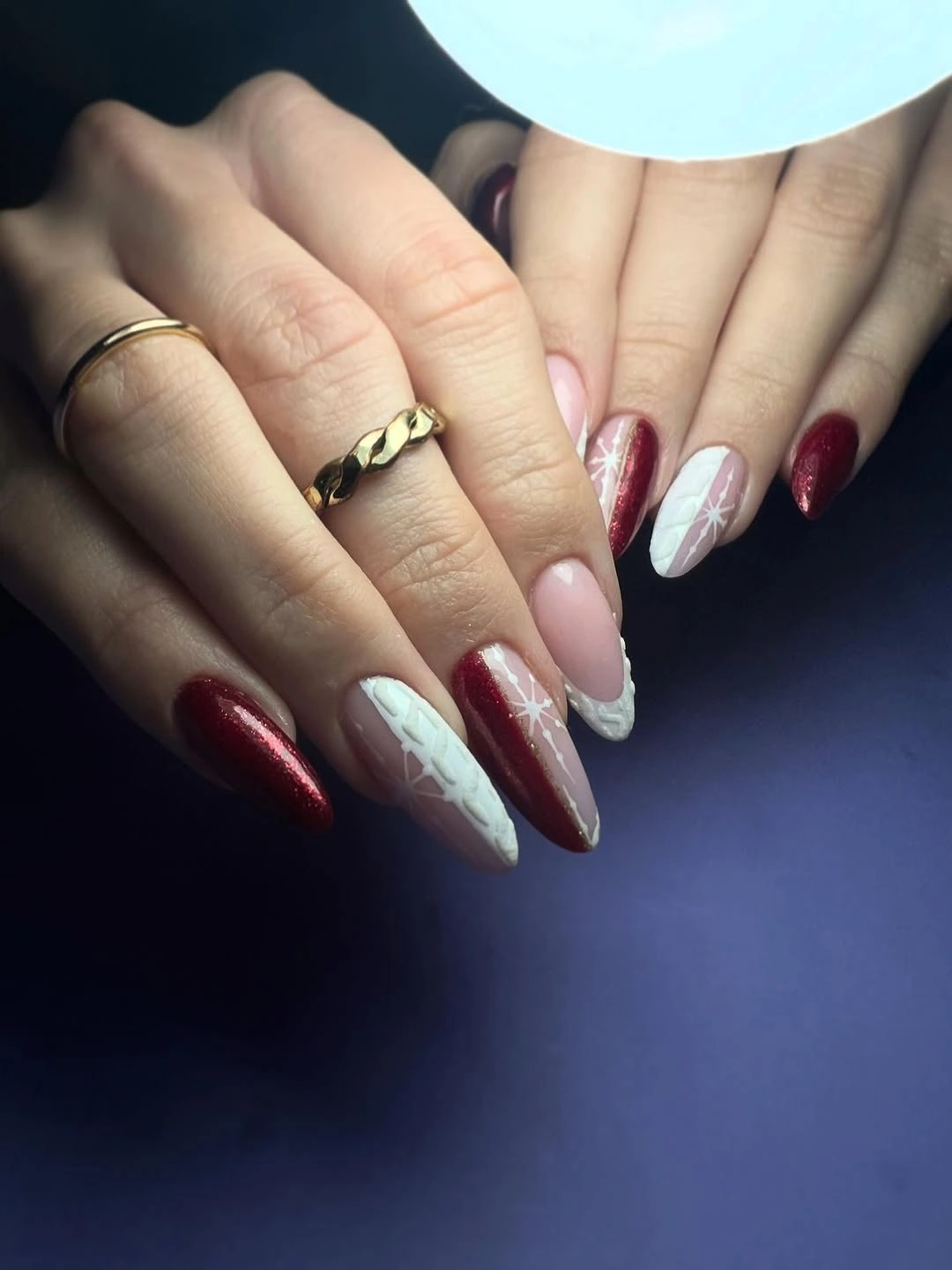 Long pointed nails in deep glossy cherry red