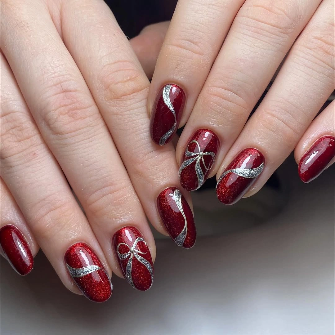 Red and white almond nails with dots and festive details