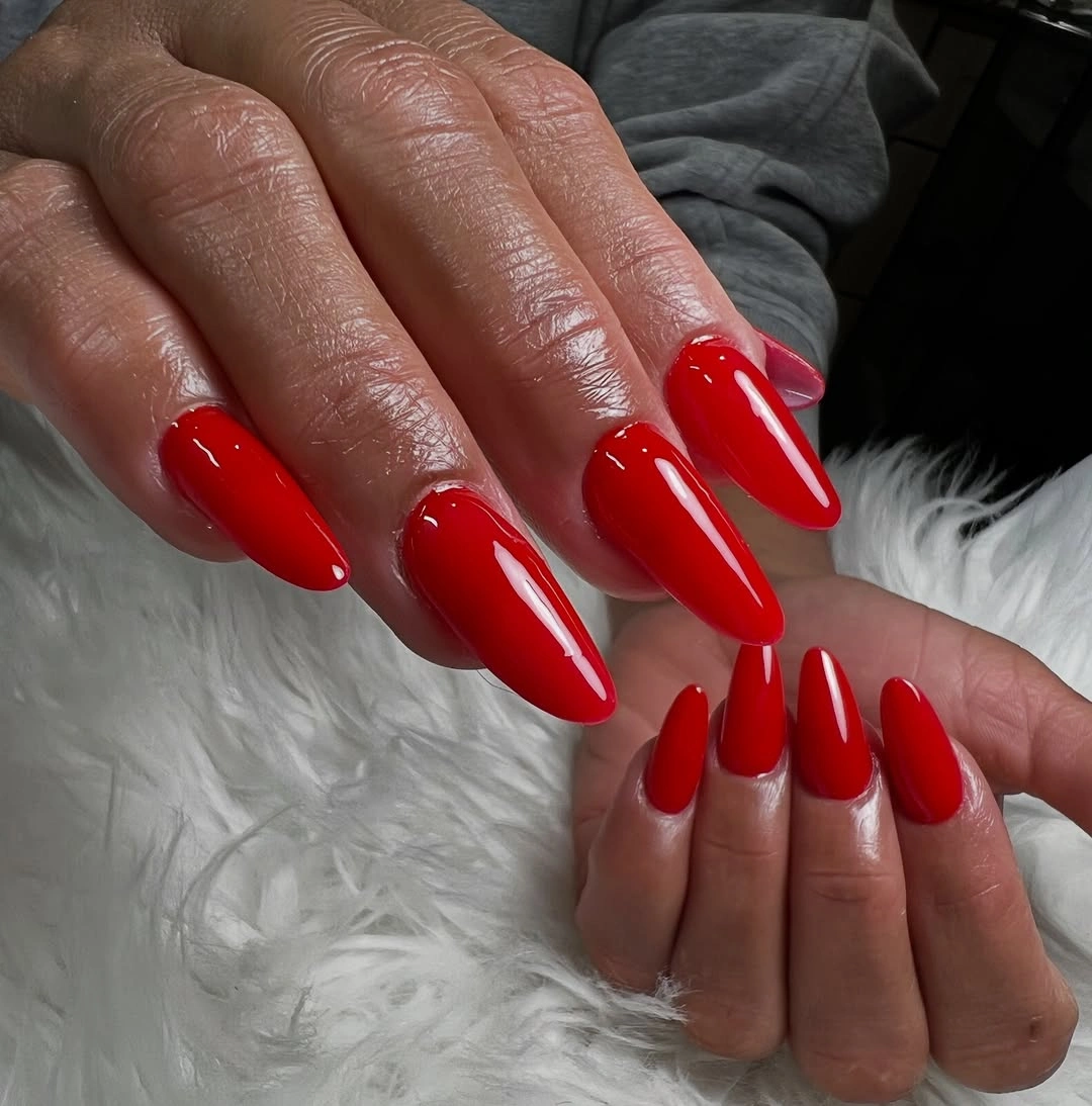 Long glossy red almond nails with uniform solid color