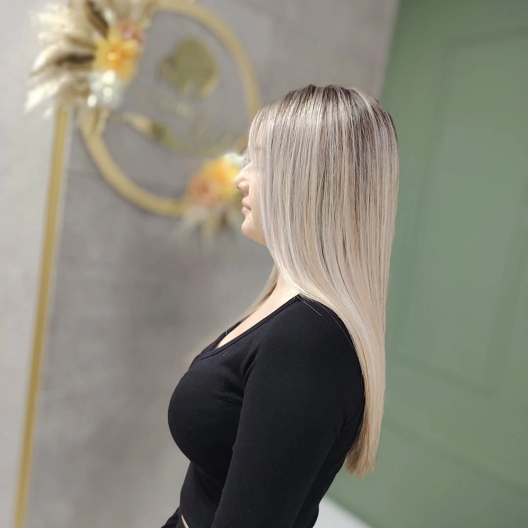 Long straight pearly blonde hair with subtle shadowed crown