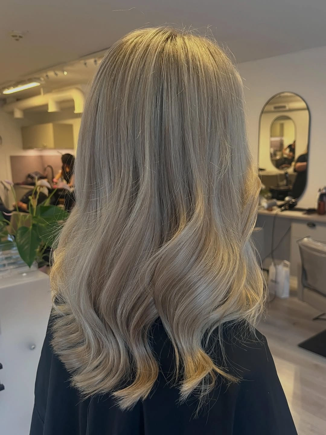 Medium-long ash blonde waves with smoky crown and beige lengths