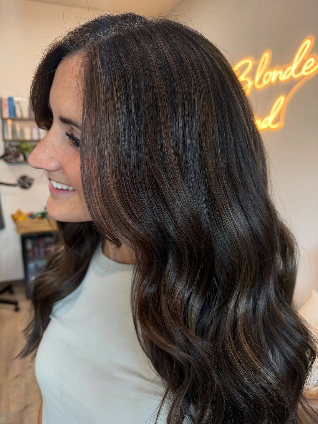Long glossy brunette waves with warm chestnut ribbons