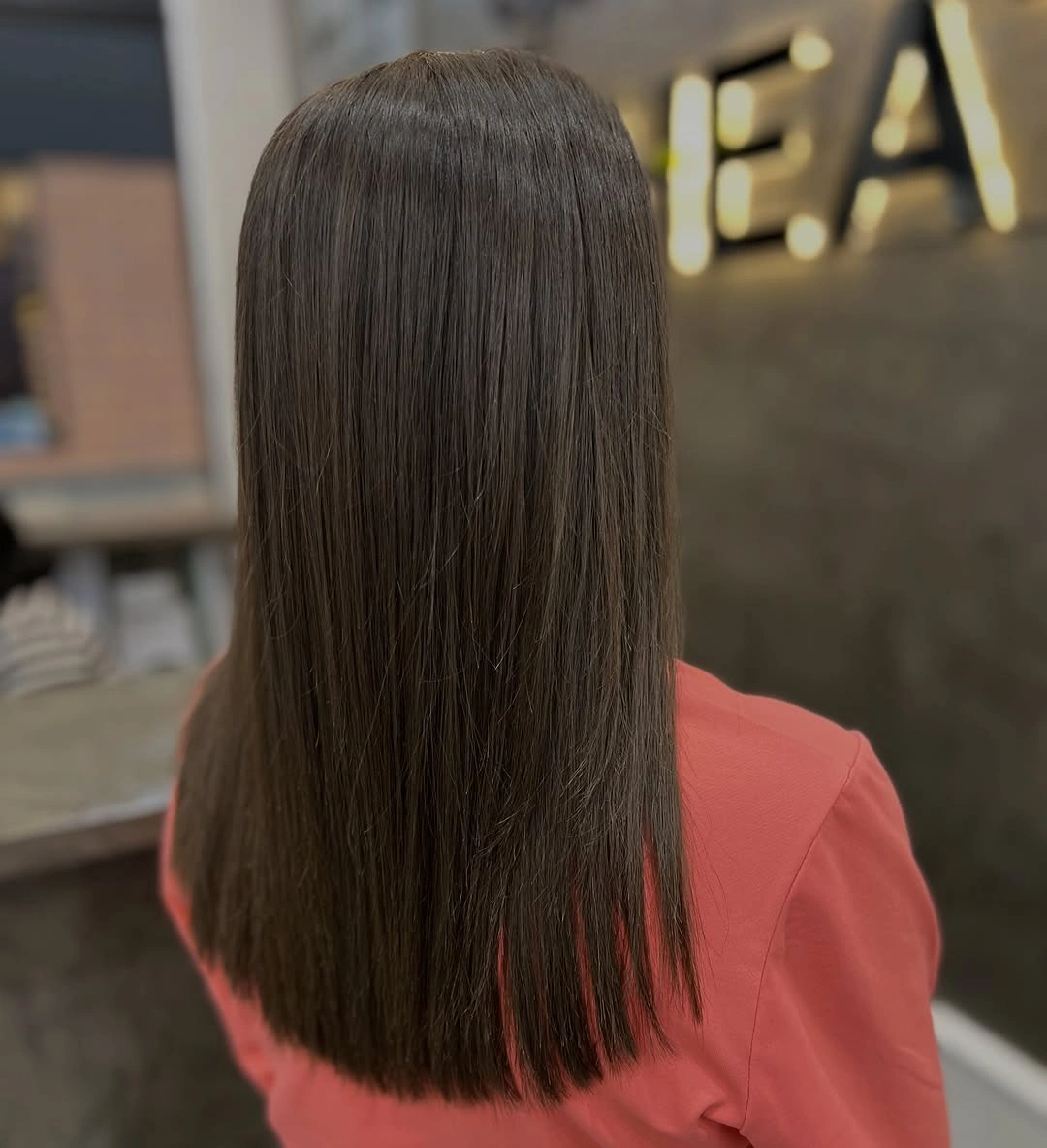 Long straight brunette hair with even dark brown color