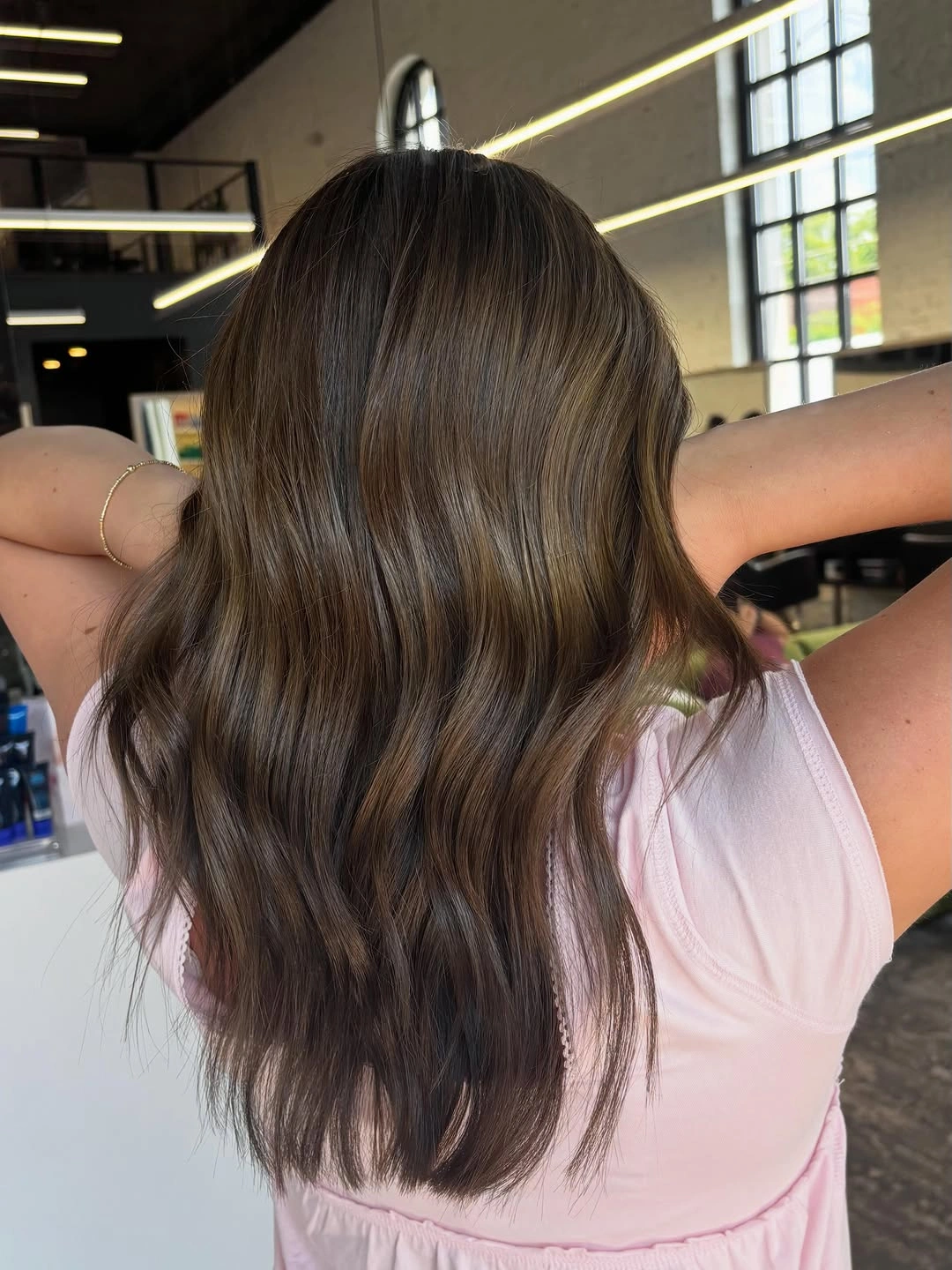 Long brunette waves with muted beige taupe highlights