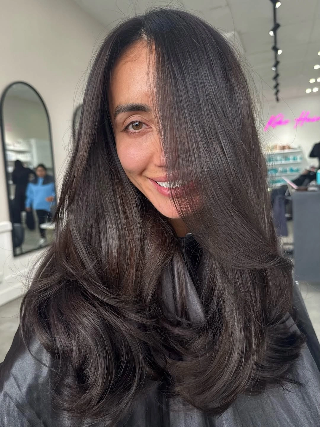 Long dark brunette layers with glossy rounded ends