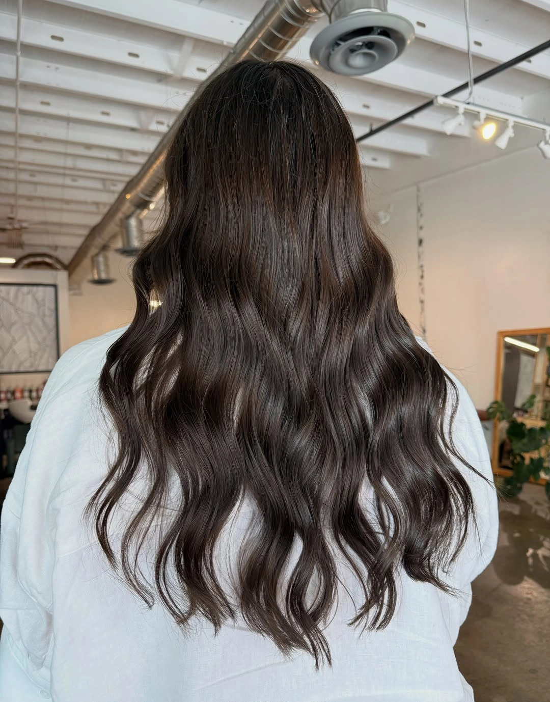 Long dark brunette waves with soft mocha reflections